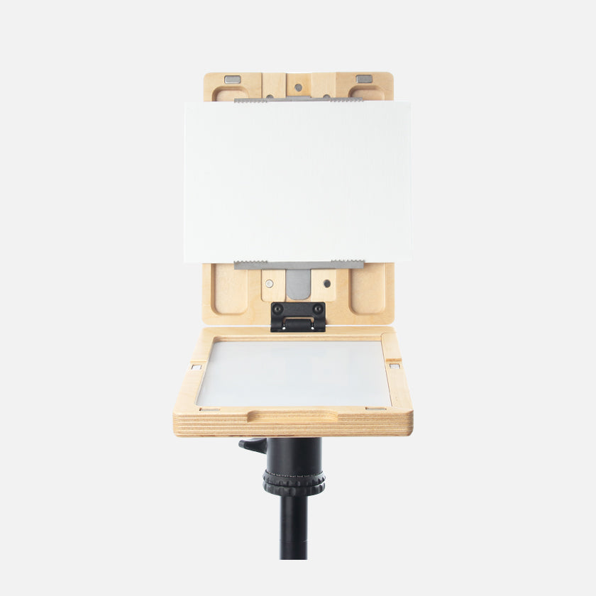u.go Plein Air Anywhere Pochade Box, 6" x 8" model, on tripod with canvas panel