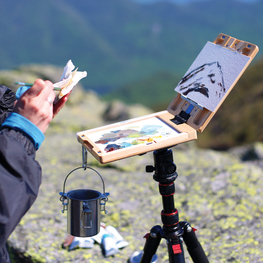 u.go Plein Air Anywhere Pochade Box, 6" x 8" model, on tripod outdoors