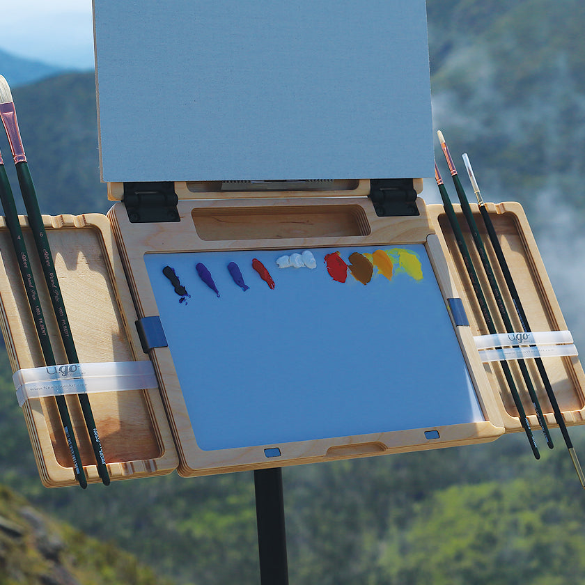 tow u.go Plein Air Cinches holding brushes on a vertical u.go Anywhere Pochade Box setup